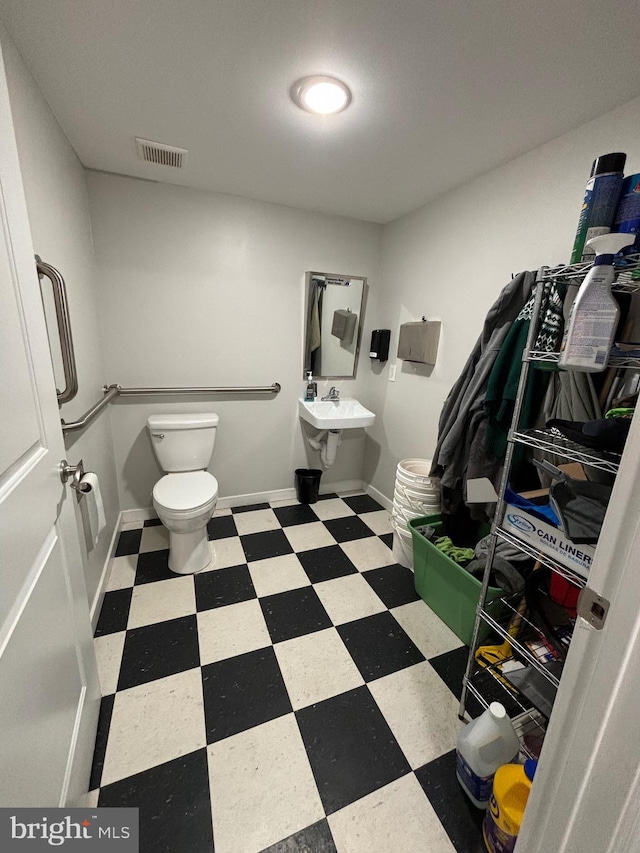 bathroom featuring toilet