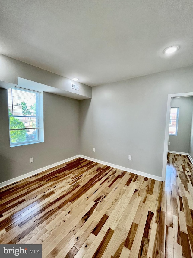 spare room featuring light hardwood / wood-style floors