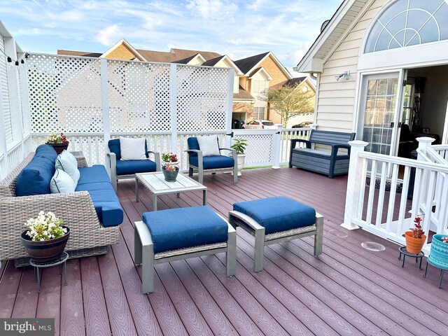 wooden terrace with outdoor lounge area