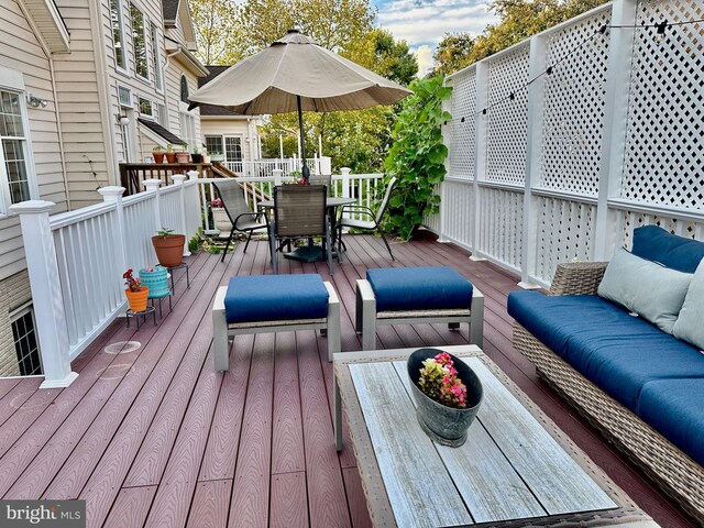 deck with an outdoor hangout area