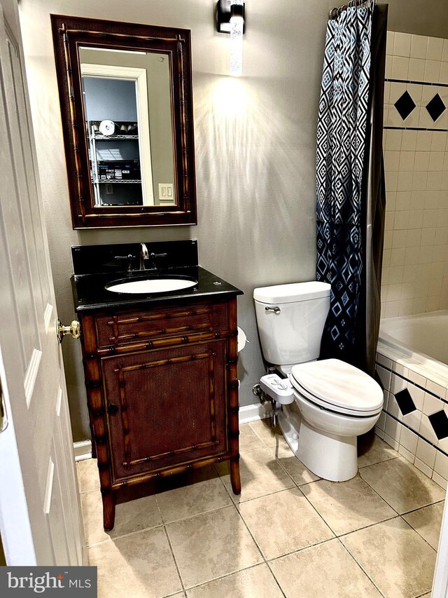 full bathroom with tile patterned flooring, vanity, toilet, and shower / bathtub combination with curtain