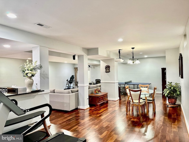 dining room featuring a chandelier and wood-type flooring