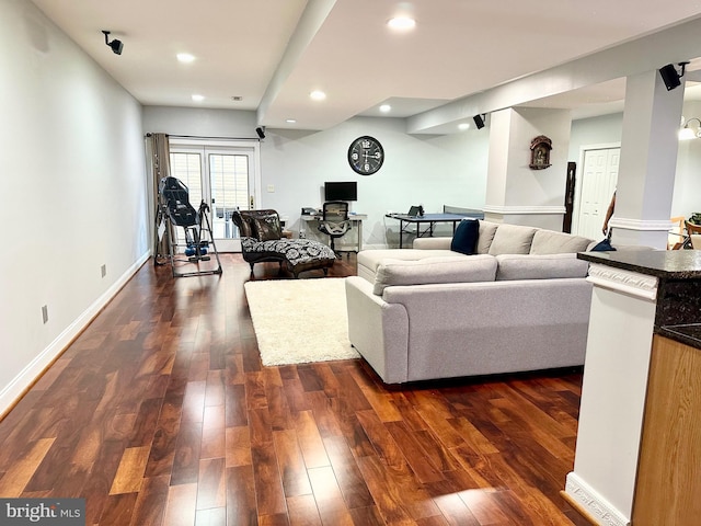 living room featuring dark hardwood / wood-style flooring