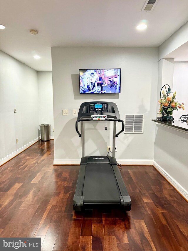 exercise area with dark hardwood / wood-style floors