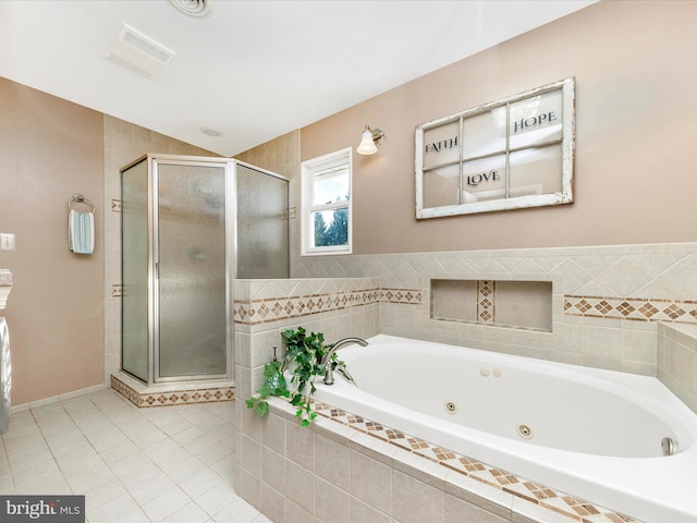 bathroom featuring tile patterned flooring and plus walk in shower