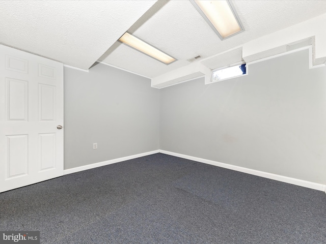 basement with a textured ceiling