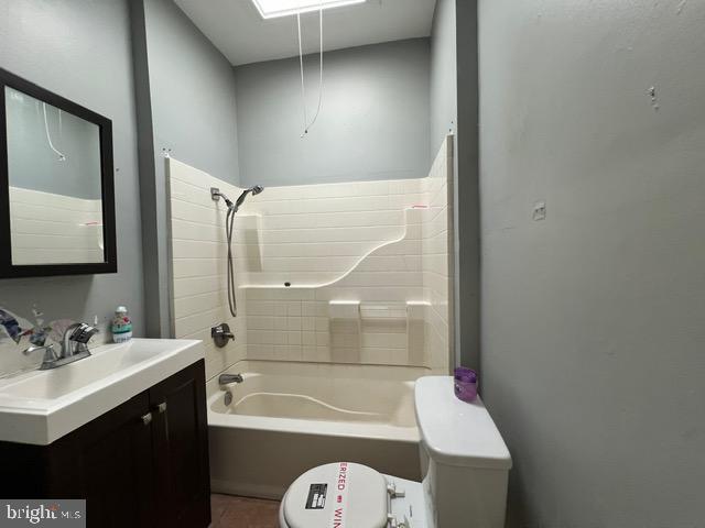 full bathroom featuring vanity, toilet, and tub / shower combination