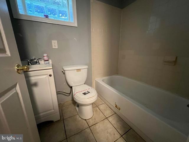 bathroom featuring tile patterned flooring, vanity, and toilet