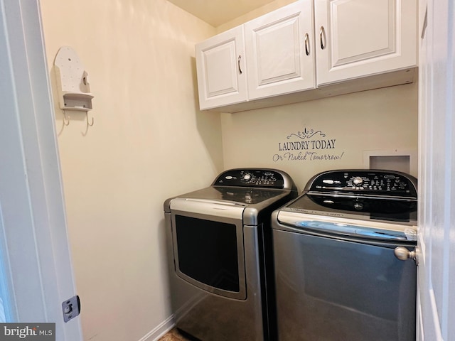 laundry area featuring cabinets and washing machine and clothes dryer