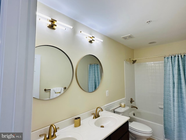 full bathroom featuring shower / tub combo with curtain, vanity, and toilet