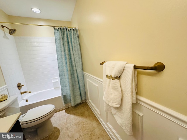 full bathroom featuring shower / tub combo, vanity, tile patterned flooring, and toilet