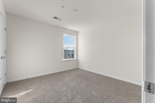 unfurnished room featuring carpet flooring