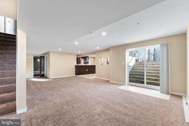 unfurnished living room with light carpet