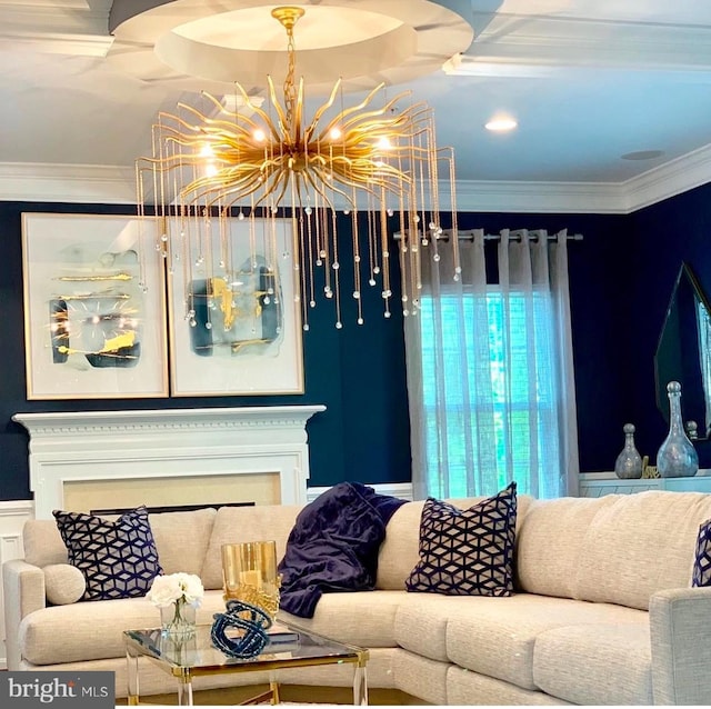 living room with ornamental molding and a chandelier