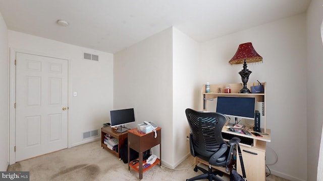 office space with light colored carpet