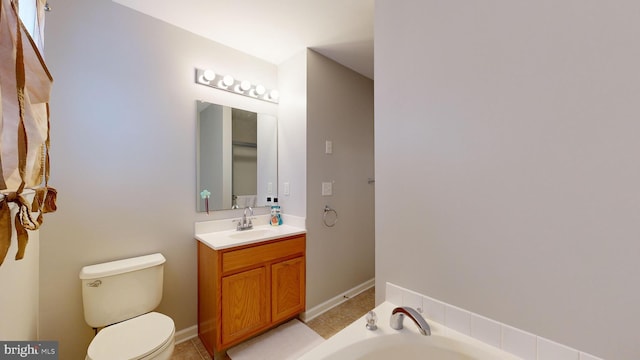 bathroom featuring a bath, tile patterned floors, vanity, and toilet