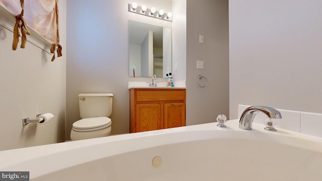 bathroom with toilet and vanity