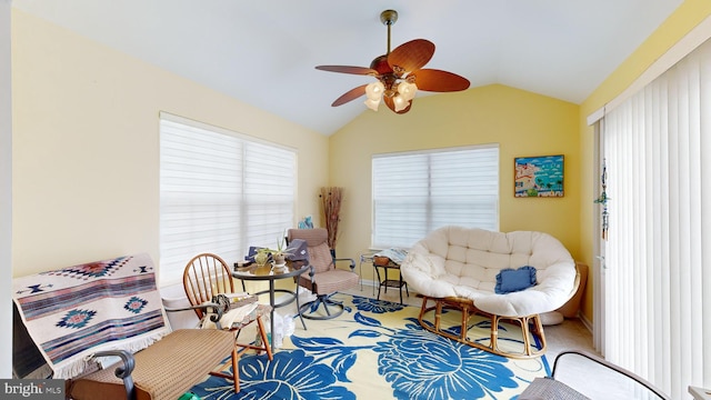 sitting room featuring vaulted ceiling and ceiling fan