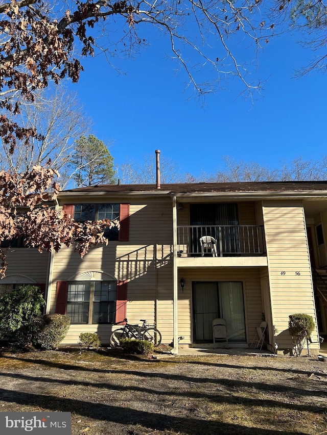 rear view of house with a balcony