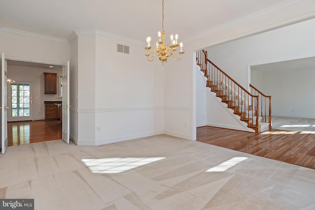 interior space with light carpet, stairway, visible vents, and crown molding