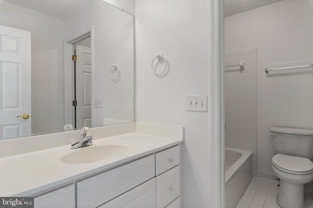 bathroom featuring toilet, tile patterned floors, and vanity