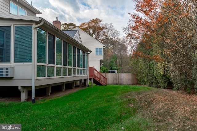 view of yard with a sunroom