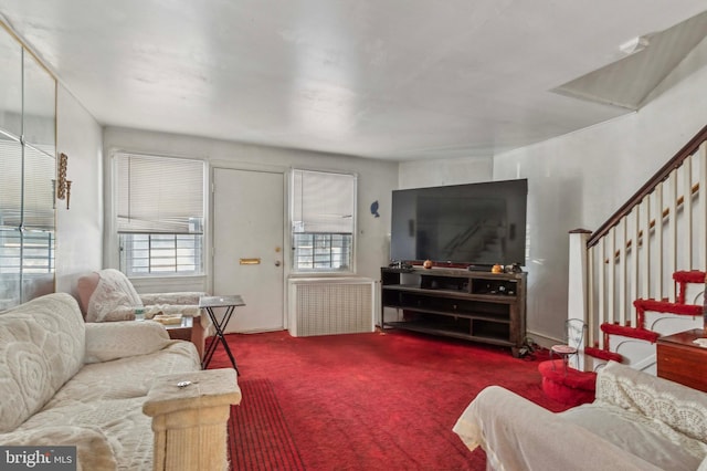 carpeted living room featuring radiator heating unit