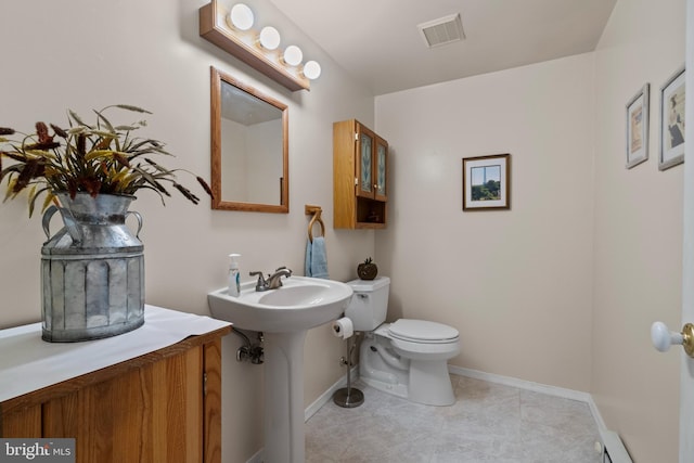 bathroom featuring tile patterned floors, sink, and toilet