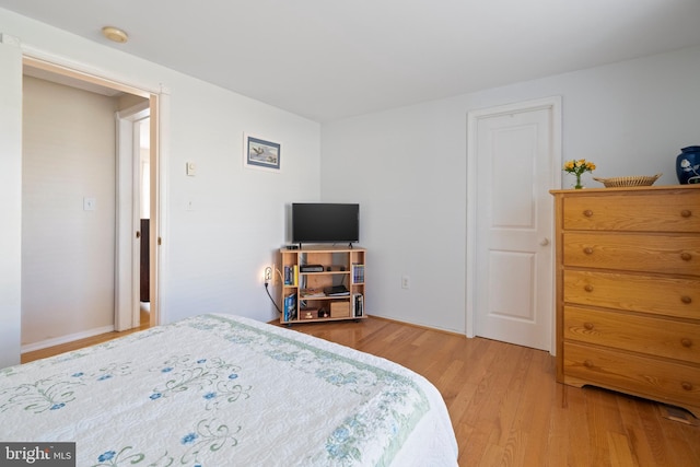 bedroom with light wood-type flooring