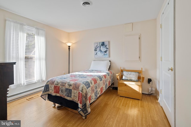 bedroom with light hardwood / wood-style floors