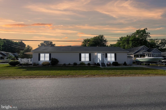 ranch-style house with a yard