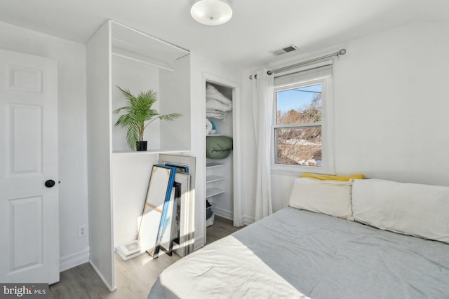 bedroom with wood-type flooring