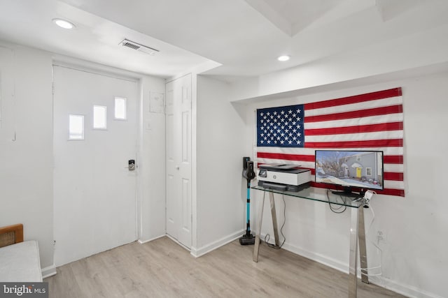 foyer entrance featuring wood-type flooring