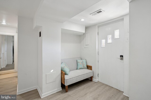 sitting room with light hardwood / wood-style flooring