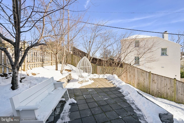 view of snow covered patio