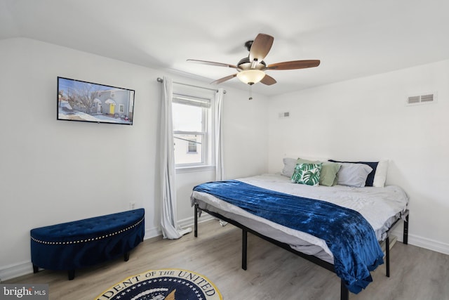 bedroom with ceiling fan and light hardwood / wood-style floors