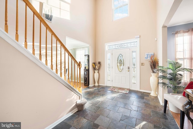 entryway featuring a high ceiling