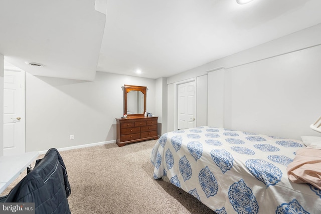 bedroom with carpet flooring and a closet