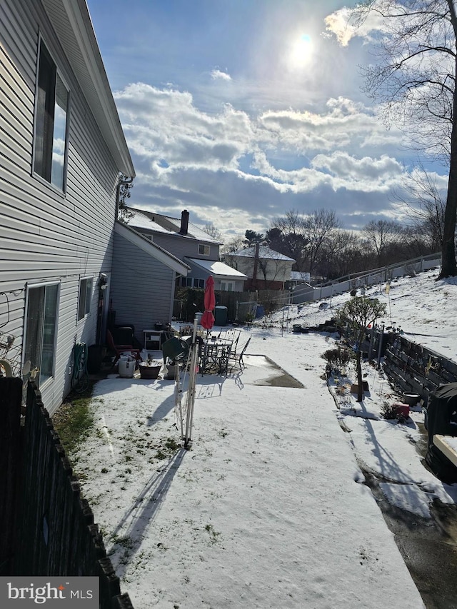 view of yard layered in snow