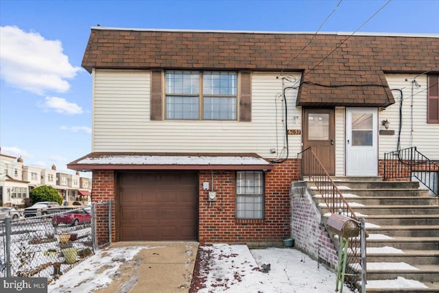 view of front of property featuring a garage