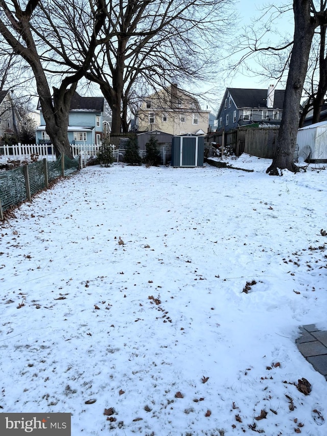 view of yard layered in snow