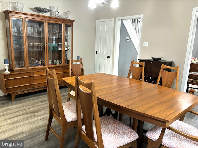 dining space with wood-type flooring