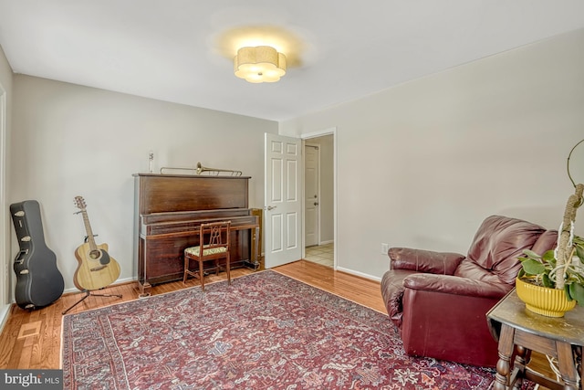 living area with hardwood / wood-style floors