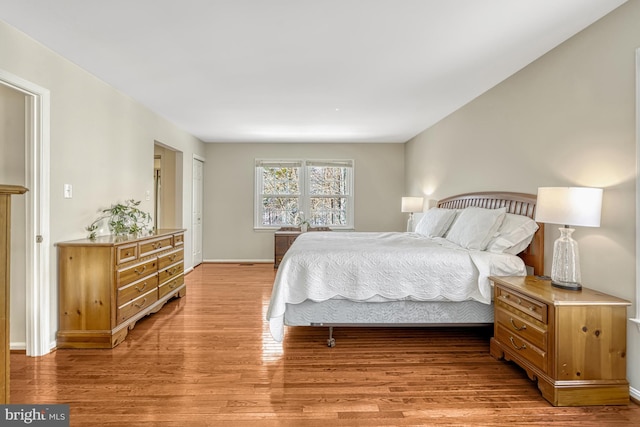 bedroom with light hardwood / wood-style floors