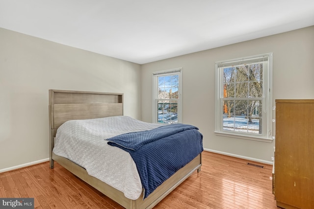 bedroom with wood-type flooring