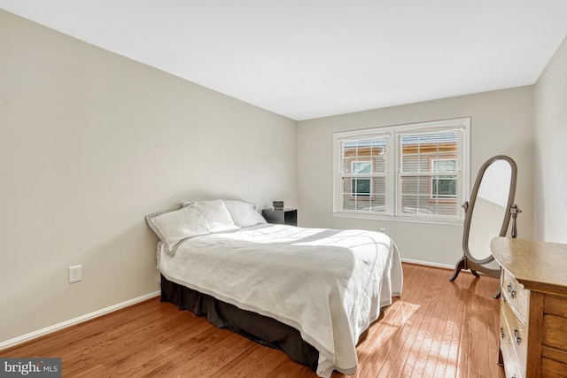 bedroom with light wood-type flooring