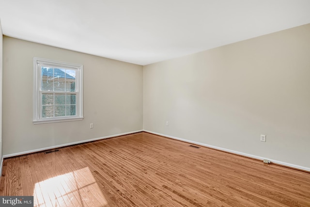 empty room featuring hardwood / wood-style floors