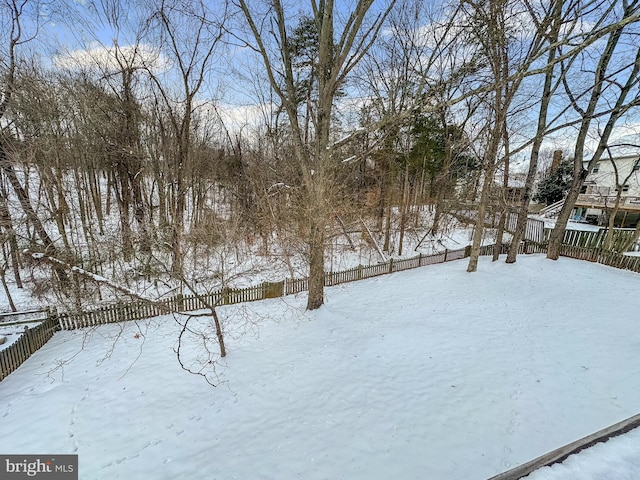 view of yard layered in snow