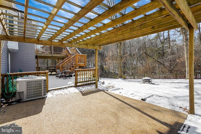 snow covered patio with central AC unit, a pergola, and an outdoor fire pit