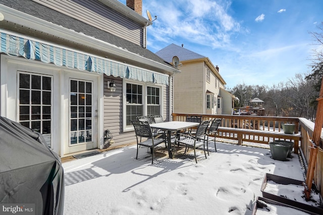 view of snow covered deck